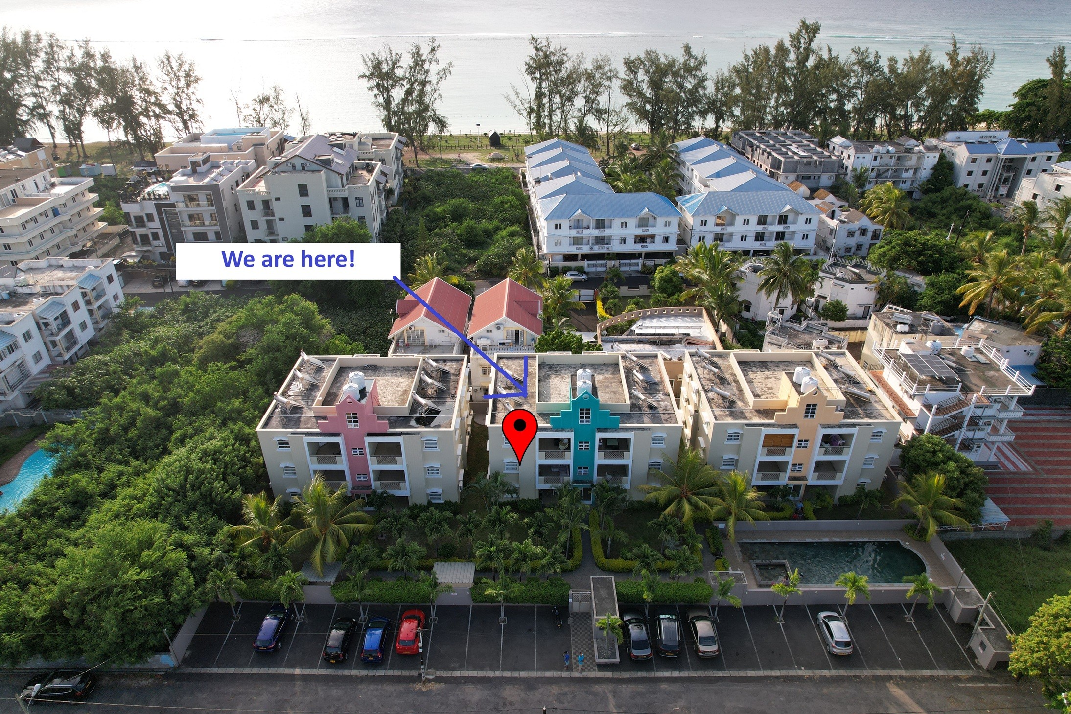 Aerial view of the property — lagoon in the background, five minutes' walk away